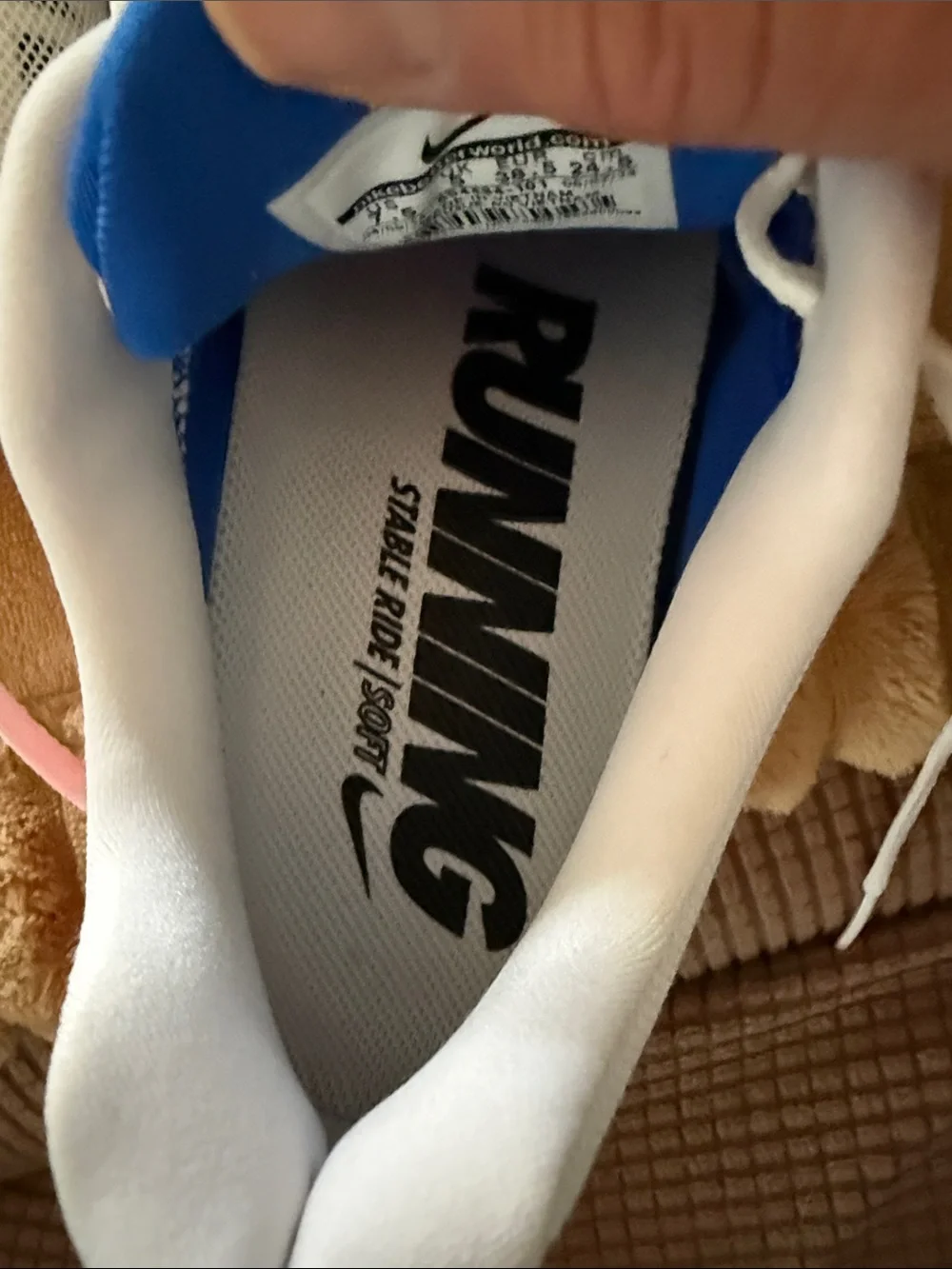 Nike Women's White Running Shoes with Blue and Pink Accents